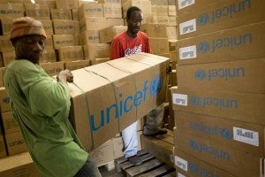 On 11 November, men load emergency medical supplies at a UNICEF warehouse in the port city of Gonaïves in Artibonite Region. The supplies, which bear the UNICEF logo, are for areas affected by the cholera outeak. By 11 November 2010 in Haiti, the cholera outeak that began in Artibonite Department had spread to four other departments, infected 9,123 people and killed 583. One case has also been confirmed and dozens more are suspected in Port-au-Prince, the capital where some 1.3 million people live in dense camps with inadequate sanitation facilities, making them highly vulnerable to a possible epidemic. Cholera is a deadly bacterial infection spread through contaminated food and water; children are the most vulnerable. The outeak, which began on 21 October, is the countrys biggest medical crisis since the 12 January earthquake. Even before the quake, Haitis access to sanitation was among the worst in the world, a situation that is now greatly exacerbated by ruined infrastructure. Recovery operations made significant progress in providing safe water and sanitation to quake survivors, but communicable diseases remain a threat. Flooding and other damage caused by Hurricane Tomas, which hit the country late last week, further strains ongoing response efforts. The Government and other partners are establishing cholera treatment centres throughout the country and launching a public information campaign on cholera prevention. Haitis sanitation agency, DINEPA (Direction Nationale de l'Eau Potable et de l'Assainissement), is also distributing chlorine tablets and safe water, and is testing water sources for contamination. Working with the Government, UNICEF and partners are providing medical teams, distributing water purification chemicals, antibiotics, oral rehydration salts (ORS) and therapeutic foods to affected regions; as well as accelerating cholera prevention and treatment efforts in Port-au-Prince.
