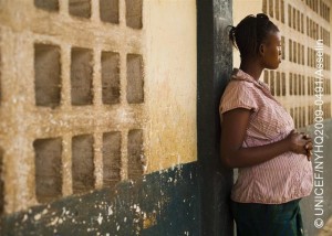 A girl, 15 years old and pregnant, leans against a wall in the city of Maburaka. She became pregnant while in secondary school. The father of the baby disappeared when he learned of her situation. Pregnancy is the third most common reason students drop out of primary school. In March 2009 in Sierra Leone, children and adolescents continue to face barriers to protection and education. Infant mortality and under-five mortality rates remain the highest in the world, and nearly a third of the countrys children lack a primary caregiver. Girls are particularly vulnerable, contending with gender-based discrimination and harmful social practices, including child marriage and female genital mutilation/cutting (FGM/C). Some 56 per cent of girls marry before the age of 18, and 94 per cent of girls are subject to FGM/C, a procedure that can cause infection, chronic pain, complications during pregnancy and delivery, and increased rates of infant mortality. Education remains a hurdle for all children, with only half of all primary schools presently functioning. Dropout rates are high, particularly among girls, orphans, and children affected by poverty or sexual exploitation. UNICEF is responding to these conditions by working with Government officials and NGOs to rehabilitate schools and implement standards of care for all children. UNICEF is also working with community groups to promote girls education.