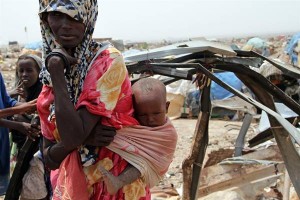 On 16 August, Amina Ali carries her baby in Bouldougo, a slum area on the outskirts of Djibouti City, the capital. Ms. Ali, a widowed mother of four, is a Somali refugee whose family had been living in Ethiopia. After the last of her cattle died three months ago, she walked for eight days to reach Bouldougo. The area is missing even the most basic services. In Somali, Bouldougo means knocked out; some 400 families live in the area, including Somali refugees arriving from Somalia and Ethiopia. Ms. Ali now sells wood to support her family. I prefer to be here, she said. After my cattle in Ethiopia died, I have nothing to go back to. On 18 August 2011, the crisis in the Horn of Africa affecting primarily Kenya, Somalia, Ethiopia and Djibouti continues, with a worsening drought, rising food prices and ongoing conflict in Somalia. Some 12.4 million people require assistance due to the regions worst drought in 60 years. Djibouti is proportionally the second most affected country in the region; approximately 20 per cent of the population more than 165,000 people require assistance, including 80,000 living in drought-affected areas. The country is one of the most water-scarce in the world, with chronic water shortages, but the situation has worsened this year. Malnutrition has been at emergency levels since 2002, but has peaked in recent months; most recent estimates indicate one fifth of children are suffering from moderate or acute malnutrition, one third are underweight, and nearly half are stunted. Additionally, over 17,000 refugees most of them from Somalia have arrived in the Djiboutis Ali-Addeh camp, which normally has a capacity of 7,000. UNICEF is supplying water and therapeutic food in the camp, and is assisting the Government of Djibouti with aid logistics. Together with Governments, UN, NGO and community partners, UNICEF is also supporting a range of interventions and essential services throughout the region. A joint United Nations appeal for humanitarian assistance for the region requires US$2.4 billion; there remains a shortfall of US$1.1 billion.