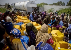 On 27 July, people collect water during a distribution in a camp for people displaced by the drought, in Mogadishu, the capital. The water is being distributed by troops from AMISOM (the African Union Mission in Somalia) from their base supplies. AMISOM was established by the United Nations to support peace, stability and the safe delivery of humanitarian aid in the country. UNICEF works on all sides of the long-running conflict.  By 29 July 2011, the crisis in the Horn of Africa  affecting primarily Kenya, Somalia, Ethiopia and Djibouti  continues, with a worsening drought, rising food prices and an ongoing conflict in Somalia. More than 12 million people are threatened by the regions worst drought in 60 years. Some 500,000 severely malnourished children in drought-affected areas are at imminent risk of dying, while a further 1.6 million moderately malnourished children and the wider-affected population are at high risk of disease. Somalia faces one of the worlds most severe food security crises; and as many as 100,000 displaced people have sought security and assistance in Mogadishu, the still-embattled capital, in the last two months, and tens of thousands are fleeing into Kenya and Ethiopia. Famine has been declared in the Lower Shabelle and Bakool areas, and it is believed all of Southern Somalia could fall into a state of famine without immediate intervention. Across Southern Somalia, 1.25 million children are in urgent need of life-saving assistance, and 640,000 are acutely malnourished. UNICEF has delivered supplementary feeding supplies for 65,000 children and therapeutic food for 16,000 severely malnourished children in Southern Somalia, and is working with UN, NGO and community partners to expand blanket supplementary feeding programmes where needed. UNICEF is also supporting a range of other interventions, including an immunization campaign targeting 40,000 children in Mogadishu. A joint United Nations appeal for humanitarian assistance for the region requires US$2.5 billion, less than half of which has been committed.