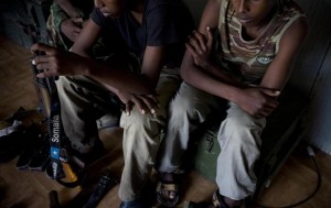 On 27 July, Asad [NAME CHANGED] (left) holds a gun in a reception centre for former soldiers from the rebel Al-Shabaab group, in Mogadishu, the capital. About 15 days ago, I was on my way back from school when some men with long beards approached me and told me that they wanted to give me some money, he said. They handed me 40 US dollars... They said if I went with them that I could keep the money they had given me. So I went with them to a camp that was near to Mogadishu. There were many men in this camp and lots of other children around my age. I was given a place to sleep and we were given lessons in things like guns and weapons... They were nice to us, these people. They never shouted at us and only wanted us to be good at shooting... A few days ago we were told that we were leaving the camp for the front line in Mogadishu. We walked to a group of houses where we waited. Then very early yesterday morning there was a big attack... There was a lot of shooting and firing and shouting& I fired all of my bullets and then realized that all of our colleagues in buildings around us had gone& So we decided to surrender. We walked out of where we were with our arms and guns above our heads. The AU [African Union] soldiers treated us very well and didn't fire at us. I was scared they might. The soldiers told us to put the weapons down and then gave us some food and water. They were kind to us& I hope that I can go home. Al-Shabaab forces control much of southern and central Somalia. AMISOM was established by the United Nations to support peace, stability and the safe delivery of humanitarian aid in the country. UNICEF works on all sides of the long-running conflict.  By 29 July 2011, the crisis in the Horn of Africa  affecting primarily Kenya, Somalia, Ethiopia and Djibouti  continues, with a worsening drought, rising food prices and an ongoing conflict in Somalia. More than 12 million people are threatened by the regions worst drought in 60 years. Some 500,000 severely malnourished children in drought-affected areas are at imminent risk of dying, while a further 1.6 million moderately malnourished children and the wider-affected population are at high risk of disease. Somalia faces one of the worlds most severe food security crises; and as many as 100,000 displaced people have sought security and assistance in Mogadishu, the still-embattled capital, in the last two months, and tens of thousands are fleeing into Kenya and Ethiopia. Famine has been declared in the Lower Shabelle and Bakool areas, and it is believed all of Southern Somalia could fall into a state of famine without immediate intervention. Across Southern Somalia, 1.25 million children are in urgent need of life-saving assistance, and 640,000 are acutely malnourished. UNICEF has delivered supplementary feeding supplies for 65,000 children and therapeutic food for 16,000 severely malnourished children in Southern Somalia, and is working with UN, NGO and community partners to expand blanket supplementary feeding programmes where needed. UNICEF is also supporting a range of other interventions, including an immunization campaign targeting 40,000 children in Mogadishu. A joint United Nations appeal for humanitarian assistance for the region requires US$2.5 billion, less than half of which has been committed.