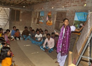 20 December 2010: Salma,18, conducting a class at a Kishori Club session, where colleagues and other peer leaders discuss various social issue such as  early marriage and eve teasing in Paharpur Village, Nachol Upazila, Chapai Nawabganj. She refused early marriage, and as a peer leader she is going door to door to advocate social change in preventing early marriage.  Legally, the minimum age of marriage is 21 for boys and 18 for girls. However, 74 per cent of girls are married before the age of 18.  Over one third of girls are married before the age of 15. Although illegal, the practice of dowry  requiring a ides family to pay significant sums to the groom  encourages the marriage of the youngest adolescent girls because younger ides typically require smaller dowries. Dowry demands can continue after the wedding and sometimes result in violence against the ide when families are unable to pay. Early marriage also causes girls to drop out of education and limits their opportunities for social interaction. Only 45 per cent of adolescent girls are enrolled in secondary school and even fewer attend regularly.  New ides are expected to work in their husbands households and are subject to the same hazards as child domestic workers. In addition, early marriage leads to early pregnancy. One third of teenage girls aged 15 to 19 are mothers or are already pregnant.  Adolescent mothers are more likely to suffer from birthing complications than adult woman.