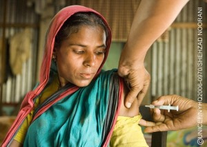 A woman is vaccinated against tetanus at a health outreach centre in the village of Kakail Chew in the eastern Ajmeriganj Subdistrict. The village is in the country's remote 'haor', or wetlands area, which is submerged under water for almost half the year. During the flooding period, villages become 'islands' and access to services is limited.  In 2006, Bangladesh continues its decades-long trend toward reducing neonatal, infant and child mortality, and is on track to achieve Millennium Development Goals for both child and maternal mortality reduction. In the last two years, sanitation coverage has also increased, and the Government aims to achieve 100 per cent coverage by 2010. However, entrenched poverty and the lack of stable governance continue to threaten the lives of children. An estimated 30 million children live in poverty, lacking minimum access to health, education and basic social services, especially in remote, rural areas. Despite modest improvements in child stunting levels, the nutritional status of children and pregnant women remains inadequate. The problem of malnutrition begins at birth, with approximately one-third of infants born underweight. In addition, arsenic contamination in the groundwater remains affects 12 to 15 million people. UNICEF supports programmes to reduce infant and maternal mortality and improve the health and nutritional status of pregnant women. UNICEF also supports early childhood development and primary education, especially for girls; immunization and growth-monitoring programmes; and community-based water and sanitation initiatives.