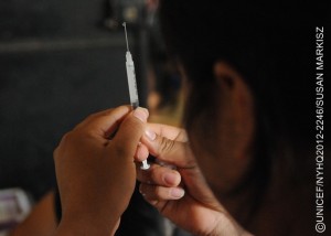 A health worker prepares a pentavalent vaccine at a health centre in the community of Corosal in Cobán Municipality, in Alta Verapaz Department. The pentavalent vaccine protects against five common diseases: diphtheria, tetanus, pertussis (whooping cough), hepatitis B and Haemophilus influenza type b (also called Hib, a cause of pneumonia and meningitis). The centre, which is open once a month, serves a population of 1,000, and is run by the Ministry of Health with support from UNICEF. Volunteer health workers provide routine health care and immunizations for pregnant women and children under 5 in five surrounding communities. [#2 IN SEQUENCE OF THREE]  In November 2012 in Guatemala, the Government and other partners are continuing to assure sustained routine immunization of children  now reaching 92 per cent of all infants  against a range of vaccine-preventable diseases. The countrys last endemic case of measles was in 1997. In the entire Americas Region (covering North, Central and South America), the last endemic measles case was in 2002 and the last endemic case of rubella was in 2009  part of global efforts to eradicate these diseases. Worldwide, measles remains a leading cause of death among young children: In 2010, an estimated 139,300 people  mainly children under the age of 5  died from the disease. Nevertheless, these deaths decreased by 71 per cent from 2001 to 2011, thanks in part to the Measles & Rubella Initiative, a global partnership led by the American Red Cross, the United Nations Foundation, the United States Centers for Disease Control and Prevention (CDC), WHO and UNICEF. In Guatemala, despite this success, significant other challenges for children remain, much of it related to poverty levels that affect more than half of all children and adolescents. Poverty also contributes to chronic malnutrition affecting half of all under-5 children (with higher rates among indigenous populations); an average national education level of under six years of primary school (under three years for the rural poor); and high, though decreasing, rates of violence. Guatemala is also one of the worlds most vulnerable countries to climate change, suffering a major climate-related emergency every year since 2008. On the positive side, birth registration is improving, with more than 95 per cent of newborns now being registered. UNICEF is working with the Government and other partners to sustain achievements in health, address the high levels of malnutrition, strengthen responses to crimes against children and increase protection services for children throughout public services.