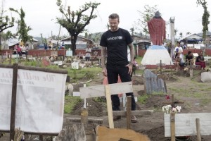 [ALL D.BECKHAM IMAGES ARE RESTRICTED. ALL UNICEF USE MUST BE CLEARED BY chloee@unicef.org.uk OR louiseo@unicef.org.uk] On 14 Feuary 2014 in the Philippines, UNICEF Goodwill Ambassador David Beckham visits a cemetery in Tanauan  one of the areas hardest hit by Typhoon Haiyan. As a UNICEF Goodwill Ambassador, seeing how children are being given a sense of normality amidst the rubble of their communities has been amazing, he said. I want to show people around the world how their generous donations have had an enormous impact on children and their families and how thankful people here are for their kindness. Mr. Beckhams T-shirt bears the UNICEF logo.