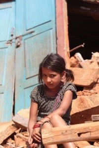 On 5 May, Samikshya Chalise, 12, sits amid rubble outside her destroyed home, in remote Gerkhutar Village Development Committee (VDC) in Nuwakot District, 1 of 12 districts that have been severely affected by the massive earthquake. Samikshyas school was also destroyed during the earthquake. Samikshya and her 8-year-old other, Sanjog, visit the destroyed school, which is near their home, all the time. I miss my school very much,