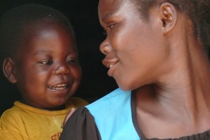 [RELEASE OBTAINED] Two-year-old Bright smiles at his aunt Leontina Chalikosa (formerly Mwewa), in Mulebambushi Village, Samfya District. Brights mother, Yvonne, died of AIDS the previous year, and Leontina is now his primary caretaker. PMTCT services were not available when Yvonne was pregnant with Bright, and she did not learn she was HIV-positive until after his birth. Bright became ill around the time his mother died; soon after, he tested positive for HIV. As part of paediatric services at the nearby Chimembe Clinic, Bright is receiving ARVs and his health has improved, though he is currently sick with malaria. [#1 IN SEQUENCE OF FIVE] In October 2010 in Zambia, clinics in both urban and rural areas are providing vital programmes to treat HIV-positive pregnant women and to prevent mother-to-child transmission of HIV (PMTCT). PMTCT programmes include HIV testing during pregnancy, antiretroviral (ARV) regimens for sick HIV-positive pregnant women, and early diagnosis and treatment for infants exposed to HIV in utero. These infants receive prophylactic antibiotics and ARVs in the weeks after they are born and are administered HIV tests at six weeks. If eastfed by an HIV-positive mother, infants continue to receive prophylactics and are tested again at 12 months and 18 months (and three months after eastfeeding ceases or at any age if they fall ill). HIV-positive infants diagnosed and treated within the first 12 weeks of life are 75 per cent less likely to die from the disease. However, many infants do not receive PMTCT services because their caregivers lack access to properly equipped facilities or fear the stigma associated with HIV. Zambia has recently made great strides in expanding PMTCT programmes. In the second quarter of 2009, ARVs were administered to approximately half of all children in need and to some 57 per cent of HIV-positive pregnant women. But for PMTCT measures to be effective, infants must adhere to a long-term, structured course of tests and services. Access to PMTCT services is particularly difficult in rural areas, where poverty rates are higher and many remote communities have limited access to health clinics. UNICEF supports the expansion of these services into rural areas, including Samfya District in Luapula Province. The province has the highest child-mortality rates in the country, and Samfyas clinics face critical staff and supply shortages. However, rural areas also tend to have lower HIV infection rates, as well as greater willingness on the part of fathers to participate in PMTCT services.