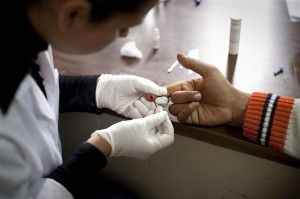 A doctor takes a blood sample from a patient at a UNICEF-supported detoxification centre in the city of Sfax, capital of Sfax Governorate.  In March-April 2011 in Tunisia, children and adolescents continue to be affected by the political changes in several countries in the Middle East and North Africa Region. Protests began in Tunisia in December 2010, leading to a change in government one month later. Political reforms are underway, though changes to address persistent hardships such as unemployment will take many months. Populist demonstrations have also affected nearby countries, with civilians protesting high food prices and unemployment rates, and demanding political change. Adolescents are participating in many of these protests, demanding that their views be considered as well. In neighbouring Libya, protests have resulted in armed conflict, and by early April, some 228,000 people had fled from Libya to Tunisia to escape the violence. Tunisian children and adolescents continue to be affected by both the revolution in their own country and by the displacement crisis on the Libyan border. Lingering insecurity is also affecting Tunisian schools, with schools reporting looting, vandalism or armed attacks in seven out of 23 regions.