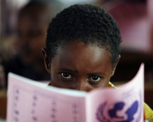 On 1 September, a boy reads during the first day of classes at Yathrib Primary School, in the eastern town of Garissa. UNICEF is increasing its support to schools in drought-affected areas, distributing education kits to schools, bedding and mosquito nets to boarding schools, and temporary learning centres to refugee camps.  From 5 to 7 September 2011, UNICEF Goodwill Ambassador Youssou NDour visited Kenya to focus renewed attention on the regions drought crisis, which continues to threaten the lives of 12.4 million people across the Horn of Africa. In Kenya, the number of people who are food insecure has increased from 2.4 million to 3.75 million, and food prices are at a record high. Some 385,000 children and 90,000 pregnant and lactating women now suffer from acute malnutrition in the countrys arid and semi-arid areas, and nationwide, the percentage of children at risk of acute malnutrition is growing. Cholera, dysentery, malaria and measles have been reported in the country, and rural communities are experiencing widespread livestock losses and conflict over pasturelands and water. A concurrent humanitarian crisis is unfolding in northern Kenya, where over 400,000 Somali refugees  56 per cent of them children  have sought shelter in the Dadaab refugee camps. Mr. NDour, a world-renowned singer and long-time child advocate, visited refugees at the Dadaab camps, where UNICEF supports immunization efforts, therapeutic feeding and temporary learning spaces for children. He also visited the camps host community in the drought-affected town of Labisigale, where UNICEF provides water and sanitation services. UNICEF, together with the Government, UN, NGO and community partners, is supporting a range of interventions throughout the region. A joint United Nations appeal for humanitarian assistance for the region requires US $2.4 billion, of which 59 per cent has been funded to date. A majority of UNICEFs portion of the appeal has been funded.