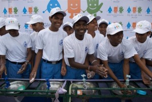 Schoolboys wash thier hands at a ceremony to celerbate Global Handwashing Day. Bhubaneswar, Orissa, India. Tom Sampson/UNICEF Oct 09