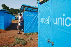 On 4 May, a woman exits a shower stall at the Danane 2 camp for people displaced by the conflict, in Danane, a town in Dix-Huit Montagnes Region. An estimated 800 people continue to live in the camp because of continued insecurity in their home areas. The stalls bear the UNICEF logo. By 5 May 2011 in Côte dIvoire, hundreds of thousands remain displaced by the violence that erupted after the 28 November 2010 presidential election. More than 320,000 people fled the country during the conflict, and many more were displaced within the country. Fighting abated after the 11 April arrest of former president Laurent Gbagbo, allowing international humanitarian operations to resume in many conflict-affected areas, and the security situation continues to improve. Still, lingering instability including reports of increasing sexual violence and harassment by armed men has delayed the return of many refugees and internally displaced people. Many hospitals and health facilities have been unable to operate properly, lacking essential drugs, equipment and staff, and millions lack access to sufficient food and water. On 16 April, for the first time since November, UNICEF was able to airlift 32 metric tonnes of medical, nutritional, educational, water and sanitation supplies into the country, and on 26 April, the Minister of Education ordered schools to reopen. With partners, UNICEF is also providing safe drinking water where needed; distributing fortified biscuits to children and pregnant and lactating women; screening children for malnutrition; conducting a back-to-school campaign aimed at a million children; conducting a polio vaccination campaign targeting 700,000 children; and conducting a measles vaccination campaign targeting 1.5 million children. UNICEF also continues to assist Ivorian refugees in surrounding countries. The Emergency Humanitarian Action Plan for Côte dIvoire and neighbouring countries requires US$160 million, only 20 per cent of which has been funded to date. UNICEFs portion of the appeal is US$17 million.