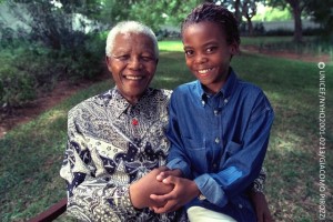 (Left-right) South African Kamo Masilo, a 12-year-old boy, and former President of South Africa Nelson Mandela join hands in Maputo, the capital, having each made their individual pledge in support of 'Say Yes' at the campaign's web site. Kamo recently participated with Mr. Mandela in the filming of a television public service announcement (PSA) to help launch the Global Movement for Children.  On 21 April 2001 in Mozambique, Nobel Peace Prize laureate and former President of South Africa Nelson Mandela and Mozambican child rights advocate Graca Machel joined 12-year-old South African Kamo Masilo to 'Say Yes for Children', an unprecedented global sign-up campaign in support of 10 overarching imperatives to improve and protect the lives of children. These are: Leave No Child Out; Put Children First; Care for Every Child; Fight HIV/AIDS; Stop Harming and Exploiting Children; Listen to Children; Educate Every Child; Protect Children from War; Protect the Earth for Children; and Fight Poverty: Invest in Children. Launching internationally on 26 April in London, the United Kingdom, 'Say Yes for Children' promises to gather millions of pledges through a worldwide outreach, from hamlets to urban centres, on paper and via the Internet. These pledges will be tallied through September of this year and presented to Heads of State and Government at the United Nations Special Session on Children, to be held 19-21 September at United Nations Headquarters. The campaign is the first major initiative of the Global Movement for Children (GMC), a coalition of some of the world's largest child rights organizations in a unique partnership to raise awareness about issues affecting children. Since Mr. Mandela and Ms. Machel launched the leadership initiative in support of the GMC in May 2000, other world leaders, celeities and notables -- including United Nations Secretary-General Kofi Annan and prominent US businessman and philanthropist Bill Gates -- are also playing key roles in the 'Say Yes for Children' campaign. The 'Say Yes' pledge form and additional information can be found at: www.gmfc.org.