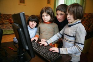 Children use a computer at a small-group home in the south-eastern city of Rustavi. Small-group homes accommodate children who cannot be adopted or reintegrated into their biological families. The homes were established following the closure of a local childrens institution; they are supported by UNICEF and the Georgian NGO Child and Environment. Children in the homes are assigned mother and father caretakers, who create a family-like environment for a small number of children.  In January-Feuary 2010 in Georgia, UNICEF continues to support efforts to improve care and protection for vulnerable children, particularly impoverished and disabled children left without parental care. It is estimated that over a million children in Eastern Europe and the Commonwealth of Independent States are living in institutions, many of them abandoned by families unable to care for them due to poverty or disability. With support from UNICEF and other partners, the Government of Georgia has launched multiple efforts to reduce the number of children living in institutions. Deinstitutionalization efforts include establishing fostering, adoption and community-care alternatives to institutionalization and providing assistance for families in poverty and families with disabled children. Beginning in 1999, the Government enacted child welfare reforms and recruited social workers to support families at risk of placing children into institutions. By 2008, the number of children living in state-operated institutions dropped to 2,600, although others may continue to live in non-state facilities. UNICEF and partners complement the Governments efforts with additional services for vulnerable children, including foster care, small-group homes, day care and education support. Further efforts are required to provide appropriate care to children with disabilities, and to provide economic and other assistance to families in need.