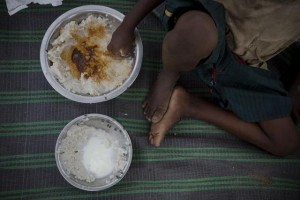 On 26 July, a boy eats a meal  his first in a week  following a food distribution in a settlement for people displaced by the drought crisis, in the Wardhiglay area of Mogadishu, the capital. His family has just arrived at the settlement.  By 29 July 2011, the crisis in the Horn of Africa  affecting primarily Kenya, Somalia, Ethiopia and Djibouti  continues, with a worsening drought, rising food prices and an ongoing conflict in Somalia. More than 12 million people are threatened by the regions worst drought in 60 years. Some 500,000 severely malnourished children in drought-affected areas are at imminent risk of dying, while a further 1.6 million moderately malnourished children and the wider-affected population are at high risk of disease. Somalia faces one of the worlds most severe food security crises; and as many as 100,000 displaced people have sought security and assistance in Mogadishu, the still-embattled capital, in the last two months, and tens of thousands are fleeing into Kenya and Ethiopia. Famine has been declared in the Lower Shabelle and Bakool areas, and it is believed all of Southern Somalia could fall into a state of famine without immediate intervention. Across Southern Somalia, 1.25 million children are in urgent need of life-saving assistance, and 640,000 are acutely malnourished. UNICEF has delivered supplementary feeding supplies for 65,000 children and therapeutic food for 16,000 severely malnourished children in Southern Somalia, and is working with UN, NGO and community partners to expand blanket supplementary feeding programmes where needed. UNICEF is also supporting a range of other interventions, including an immunization campaign targeting 40,000 children in Mogadishu. A joint United Nations appeal for humanitarian assistance for the region requires US$2.5 billion, less than half of which has been committed.