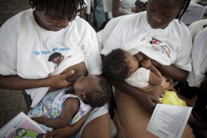 Two women eastfeed their infants during a ceremony to commemorate the beginning of World Breastfeeding Week 2011, in the UNICEF-supported maternity ward at Isaie Jeanty Hospital in Port-au-Prince, the capital. The Week  a joint initiative of UNICEF, the World Health Organization (WHO), the World Alliance for Breastfeeding Action (WABA) and other NGOs  promotes eastfeeding, the most cost-effective preventive intervention to reduce under-five mortality. In December 2011, Haiti and its approximately 4.3 million children continue to recover from the 12 January 2010 earthquake that killed some 220,000 people, displaced more than 1.6 million and further disrupted the countrys already inadequate infrastructure. Progress has been substantial: a new national government is in place; about half of the mounds of rubble have been cleared; almost two thirds of those displaced by the quake have moved out of crowded camps; and the countrys health, education and other core services are being rebuilt on a stronger foundation. Still, the country remains a fragile and impoverished state, requiring international support. Working with multiple international and national partners, UNICEF continues to address the emergency needs of children, while focusing on building the Governments capacity to uphold and sustain childrens rights. In nutrition, an unprecedented expansion of preventive and treatment services for childhood under-nutrition has begun to address the pre-quake silent crisis of chronic malnutrition. In health, routine child immunizations increased to almost 80 per cent in the past year; medicines and training for midwives have increased; HIV prevention and treatment services, including to prevent mother-to-child transmission (PMTCT) of the virus, are expanding; and a national emergency cholera treatment response was implemented (in response to the late 2010 cholera outeak). Emergency WASH (water, sanitation and hygiene) services, including for ch