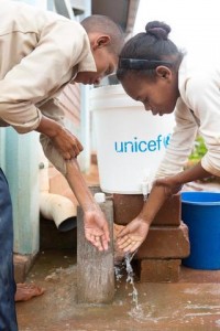 On 25 Feuary, (left-right) students Elyse Christian Mianvontsoa and Tiavina Rasoaremalala, both 12, wash their hands at a UNICEF-provided covered bucket with a faucet after using the latrine, at Lohanosy Primary School in Lohanosy Village in Analamanga Region. Many families, including theirs, are struggling to both provide food and pay their childrens school fees. I know that my parents have difficulties making money, and its a big challenge for me, so I try harder at school. I want to be a doctor when I grow up, Elyse Christian said. I like studying science and history at school. My dream is to finish school and become a teacher, Tiavina said. For me, its very difficult to follow [along] at school because we dont eat enough at home, and I often have a stomach ache. If my parents dont work, we dont have enough food. Tiavina is one of nine children in her family. Her parents grow rice for food, and her mother also makes and sells rope, to buy for food and clothing and to pay school fees. UNICEF supported construction of classrooms, the water and sanitation facilities and a sports field, as well as promotes good hygiene practices at the model primary school, which is built on land donated by the community, and with support from the Ministry of Education and the private sector. In Feuary 2015 in Madagascar, children and families continue to face considerable challenges and constraints as the island nation slowly emerges from a protracted and debilitating political crisis and the ensuing economic decline. The country remains one of the worlds poorest: 91 per cent of the population live on less than US $2.00 a day, and many of the poorest are children  who have been hardest hit in the crisis and live in extreme poverty. The crisis also resulted in a decrease in public investment in the social sectors, weakening further the delivery of basic social services, as well as access to, and use of, these vital services. The health