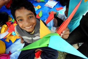 On 30 April, children play in a tent housing a UNICEF-supported child-friendly space in Tundikhel, a large grass-covered area and important landmark in Kathmanudu, the capital. A UNICEF counsellor was present at the space to talk with children about what they had endured. A temporary camp has been set up in Tundikhel for internally displaced people. By 30 April 2015 in Nepal, search, rescue and relief operations continued in the aftermath of the massive 7.8-magnitude earthquake that hit the country on 25 April. The quakes epicentre was 80 kilometres from Kathmandu, the capital. Over 5,500 people have been killed, and more than 11,100 others have been injured. Over 4.2 million people have been seriously affected, out of which an estimated 1.7 million  40 per cent  are children below the age of 18 years. Residences, schools and vital infrastructure, including hospitals, have been severely damaged or destroyed, leaving thousands of children and families homeless, vulnerable to disease outeaks and in urgent need of food, shelter, safe water and sanitation, and health support. Over 3 million people are estimated to be in need of food assistance, with 1.4 million needing priority assistance. Some 24,000 internally displaced people are being hosted in 13 camps in Kathmandu, the capital. Working with the Government and other partners, including fellow United Nations organizations, UNICEF is supporting water, sanitation and hygiene (WASH), health, nutrition, child protection, education and other interventions. In response to the disaster, UNICEF has provided tents, including for hospitals; tarpaulin sheeting; emergency medical kits; vaccines and related supplies; zinc and oral rehydration salts to prevent diarrhoeal disease outeaks; water purification tablets; hygiene kits and buckets; and temporary learning spaces. Working with partners, psychosocial services have been initiated in the districts of Gorkha, Kaski, Kathmandu, Kavre, Ramechhap and Sindhuli. UNI