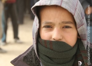 A boy stands, bundled in winter clothing, in Zaatari, a camp for Syrian refugees on the outskirts of Mafraq, capital of the northern Mafraq Governorate. The camp is currently hosting 66,394 people. On 20 December 2012 in Jordan, worsening winter conditions continue to threaten Syrian refugee children and their families. To date, 106,724 refugees from Syrias still escalating war have registered in Jordan with the United Nations High Commission for Refugees; an additional 41,868 are awaiting registration. Syrians have also fled to neighbouring Iraq, Lebanon and Turkey, and as far away as Egypt, inging the total number of registered refugees to 450,191. Inside Syria, some 2.5 million people have been affected by the conflict, of which 1.1 million are children. In Jordan, where the number of refugees continues to increase, UNICEF and partners are supporting the ongoing provision of winter supplies. In the Zaatari camp as well as in the King Abdullah Park and Cyber City transit sites for refugees, some 3,000 winter clothing kits for infants under age 1 are being distributed. Over 3,100 additional kits are also being procured for new arrivals during the winter. Additional support includes the ongoing installation of gas boilers to provide hot water in Zaataris 90 existing water, sanitation and hygiene units and the construction of 192 fully winterized units in new areas of the camp. UNICEF also supports initiatives in health, nutrition, water, sanitation and hygiene, education and child protection, including the provision of child-friendly spaces and psychosocial assistance for children traumatized by their experiences in relation to the conflict. Working with diverse governments, other United Nations organizations and local and international NGOs, UNICEF continues to respond to the needs of affected children in all host countries and inside Syria. To continue these responses over the first six months of 2013, UNICEF requires US$180 million.