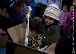 On 15 January, a girl (whose face was painted during a child-friendly activity) unpacks items from a box during a winter clothing distribution for Syrian refugee children, at the offices of a UNICEF partner NGO in the town of Baalbek in the eastern Bekaa Valley, near the Syrian border. On 1415 January 2013 in Lebanon, UNICEF Goodwill Ambassador Mia Farrow met with Syrian refugees in the northern Wadi Khaled region and the Bekaa Valley. As part of her mission, she also appealed for increased international support to respond to the escalating crisis. Inside Syria, some 4 million people are in need of humanitarian assistance, including 1.8 million children. Over 623,000 Syrians have fled the violence, seeking refuge in neighbouring Iraq, Jordan, Lebanon and Turkey, and as far away as Egypt. Lebanon is currently hosting the largest number of refugees, with over 200,000 people  approximately half of whom are children  registered or awaiting registration with the United Nations High Commission for Refugees (UNHCR). Worsening winter conditions are exacerbating the struggles of refugee children and their families; most live in makeshift shelters and tents or with host families who are already among the poorest in the country. UNICEF and partners are supporting the ongoing provision of winter supplies through: the implementation of a voucher system to enable families to purchase these supplies; the preparation of 11,000 winter clothing kits for distribution, with an additional 4,000 forthcoming; and the distribution of 9,000 plastic sheets and 10,000 blankets to partners. In total, UNICEF aims to reach 33,000 children with non-food items related to winter. Ms. Farrow spoke with refugees and host families and visited UNICEF-supported child-friendly spaces; these spaces provide psychosocial assistance, including counselling, for children traumatized by their experiences in relation to the conflict. UNICEF also supports initiatives in health, nutrition, water, sanitation and hygiene, education and child protection  responses that cover host families as well. Working with diverse governments, other United Nations organizations and local and international NGOs, UNICEF has appealed for a total of approximately US $200 million to cover response to the crisis within Syria and all host countries in the first six months of this year.