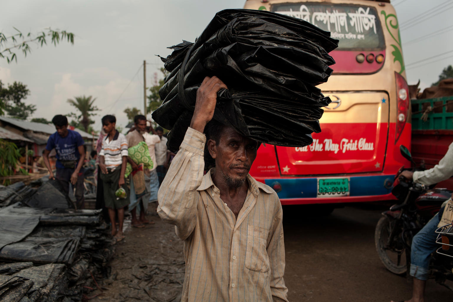 On 5 September 2017 in Bangladesh, newly arrived Rohingya families carry plastic sheeting to build a shelter at the Kutupalang makeshift camp in Cox's Bazar. As of 31 August 2017 in Bangladesh, UNICEF is working in Cox’s Bazar to address the needs of Rohingya children and their families as well as host communities. UNICEF has already built eight functioning Child Friendly Spaces (CFSs) for Rohingya children and adolescents, providing children with psychosocial and recreational support. UNICEF has initiated the screening of children for malnutrition, and the vaccination of children aged 9-59 months against Measles and Rubella - in the makeshift settlements and hard-to-reach host communities. More than 15,200 people now have access to safe drinking water and 9,700 people are provided with improved sanitation facilities in host communities. With the recent influx of Rohingyas – more than 80% of them are children and women - the demand has increased and UNICEF is working to mobilize more support and strengthen its existing activities. For recreational and psychosocial support to the newly arrived Rohingya children, 33 mobile CFSs are now operational with 100 recreational kits, Education in Emergency (EiE) kits and trained teachers. These mobile child friendly spaces have already provided psychosocial support to 226 newly arrived Rohingya children. Separated and unaccompanied children are also being identified through Child Friendly Spaces and community outreach. Over 100 adolescent clubs are operational in host and makeshift settlements to provide life-skills education through outreach activities.