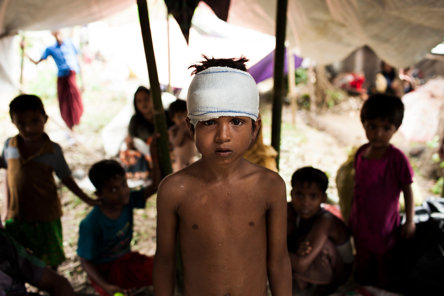 On 5 September 2017 in Bangladesh, Mohammed Yasin, 8, is amongst the newly arrived Rohingya families living in shelters at the Kutupalang makeshift camp in Cox's Bazar. As of 31 August 2017 in Bangladesh, UNICEF is working in Cox’s Bazar to address the needs of Rohingya children and their families as well as host communities. UNICEF has already built eight functioning Child Friendly Spaces (CFSs) for Rohingya children and adolescents, providing children with psychosocial and recreational support. UNICEF has initiated the screening of children for malnutrition, and the vaccination of children aged 9-59 months against Measles and Rubella - in the makeshift settlements and hard-to-reach host communities. More than 15,200 people now have access to safe drinking water and 9,700 people are provided with improved sanitation facilities in host communities. With the recent influx of Rohingyas – more than 80% of them are children and women - the demand has increased and UNICEF is working to mobilize more support and strengthen its existing activities. For recreational and psychosocial support to the newly arrived Rohingya children, 33 mobile CFSs are now operational with 100 recreational kits, Education in Emergency (EiE) kits and trained teachers. These mobile child friendly spaces have already provided psychosocial support to 226 newly arrived Rohingya children. Separated and unaccompanied children are also being identified through Child Friendly Spaces and community outreach. Over 100 adolescent clubs are operational in host and makeshift settlements to provide life-skills education through outreach activities.