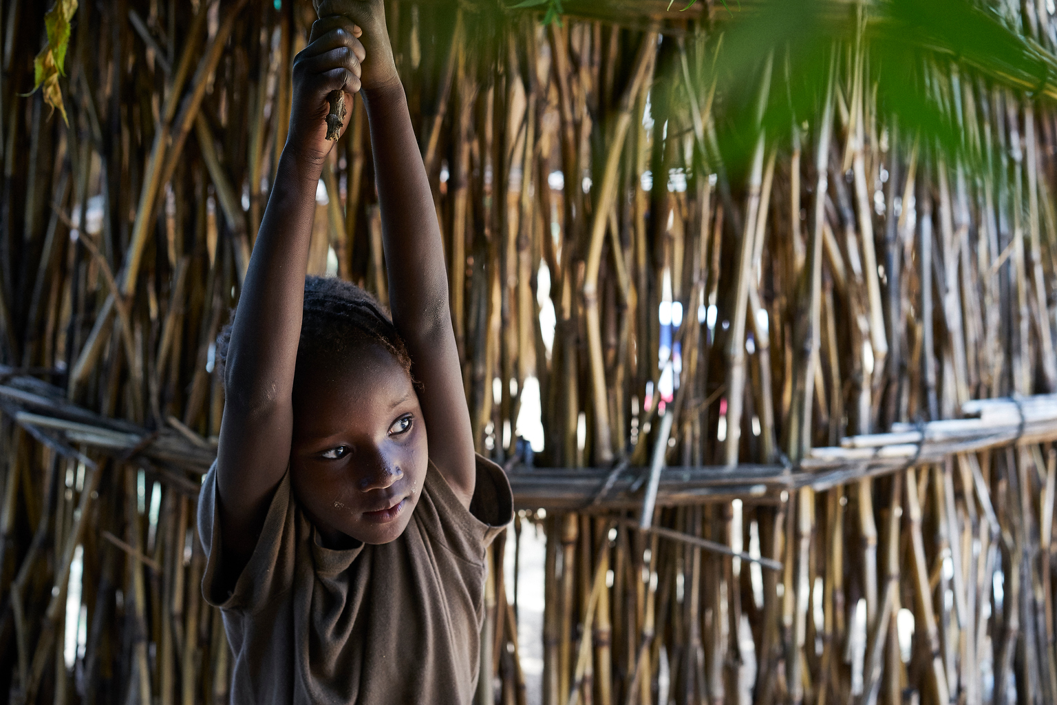 Mahazouna, 6 years old, daughter of Rahoua Bounya, 30 years old in the village of Kadazaki, Matameye department, Niger on August 14, 2016. Rahoua's husband left her more than 5 years ago to find work in Libya. She has 6 children and 4 still live with her, three boys and a girl. The two older daughters, 15 and 13 years old are already married.The older girls were not good at school and the teacher was beating them so they dropped out. The other of my husband decided to marry them because they could not just stay here and do nothing. Now I have less children to feed, its better for us. Rahoua cultivates her husbands lands and with the harvest, they can eat for 3 to 4 months. But it isnt enough. My boys are growing fast and I need money for the future lands they will need to survive on. I heard about women who had been to Algeria to beg who had become rich. I was envious. So I left in July. I was lucky because I reached Algeria in 4 days. I used all my savings and had to borrow 50,000 franc to reach Tamanrasset. Rahoua left with her two youngest children and left the others to the surveillance of their uncle. The desert was scary, I know a lot of people die out there. When I arrived two people from the village were waiting for us and they took us to a house were we stayed. In the morning, we would leave and go begging.