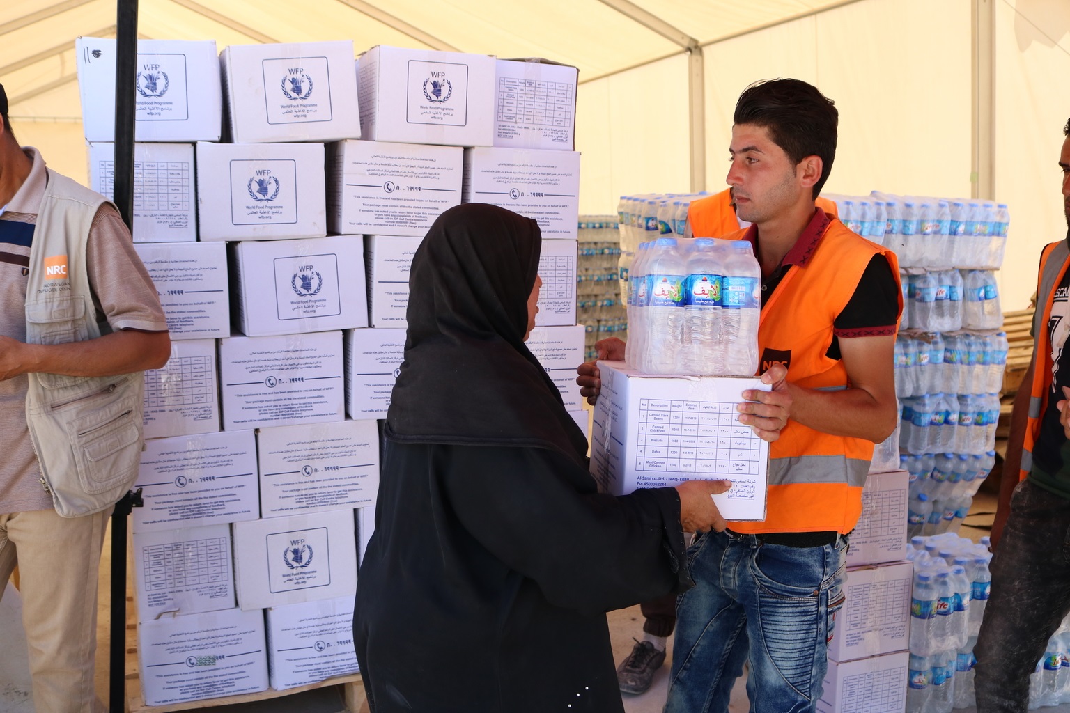 Houda, her husband and daughter are on their way back to Mosul from Hamam al-Alil (35km south of Mosul). They receive supplies to help make up for the lack of resources inside the city.